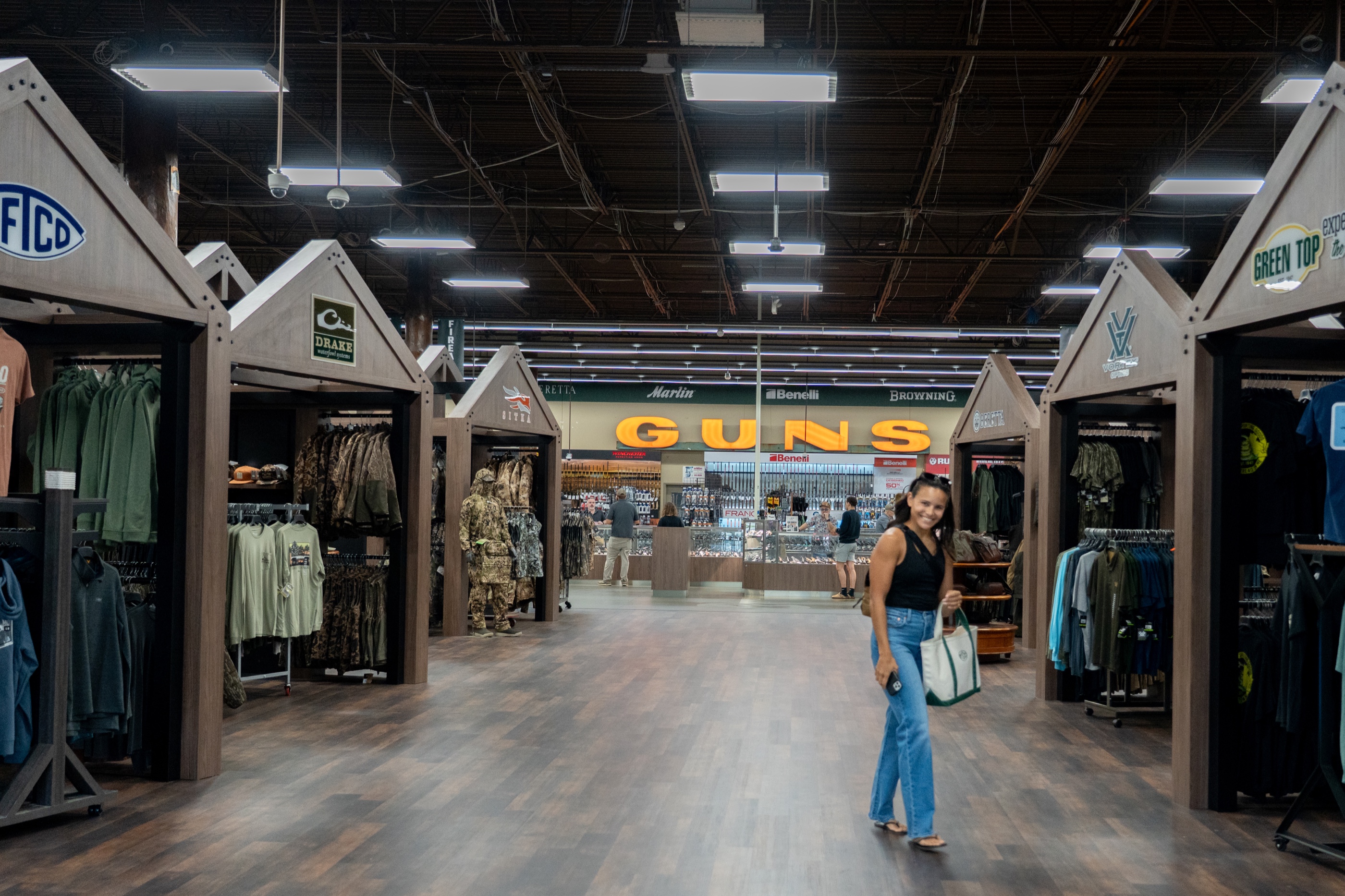 Finished Green Top sporting-goods department with custom house-shaped retail fixtures