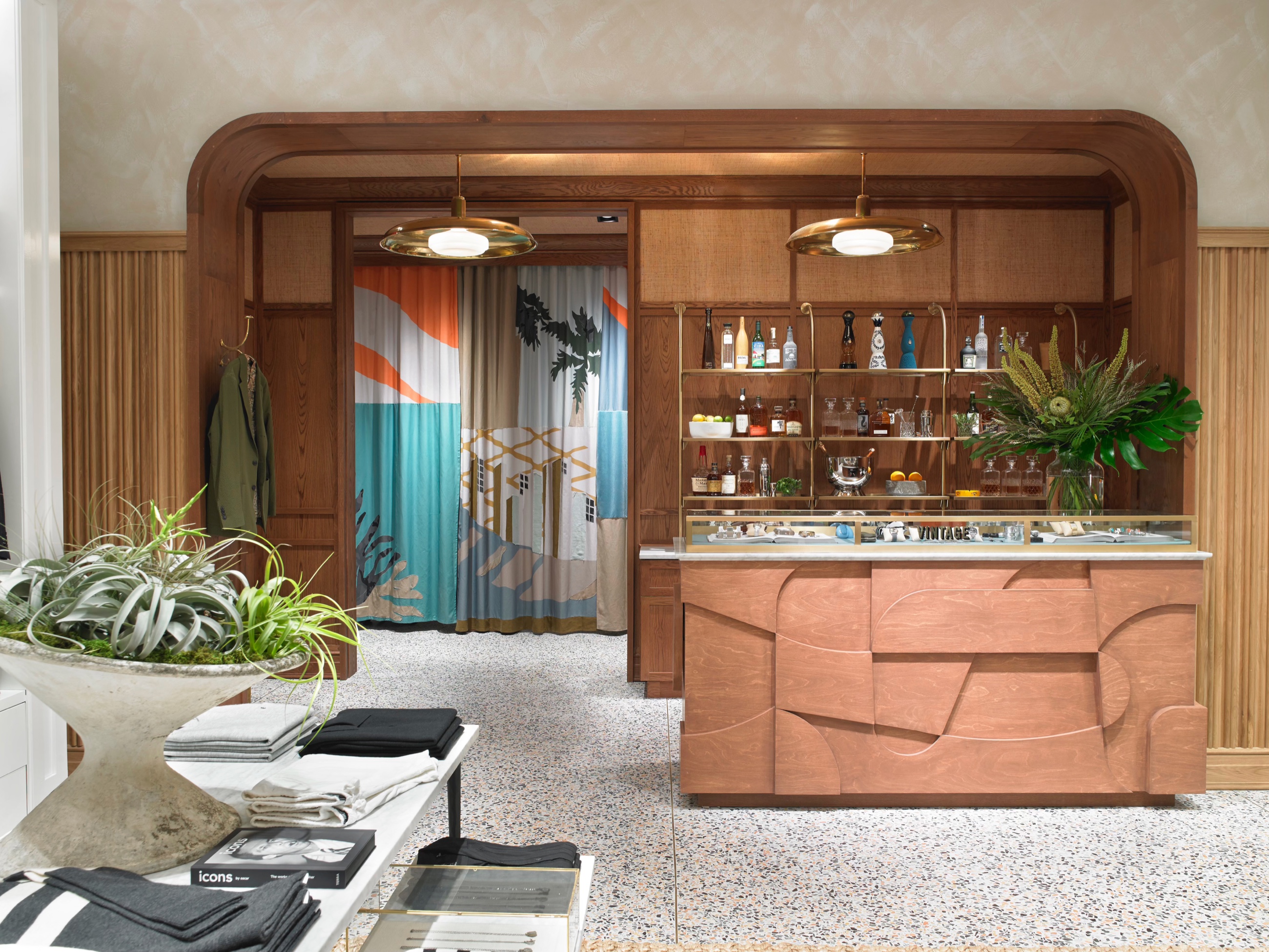 Warm wood and brass retail counter at Todd Snyder in Bal Harbour